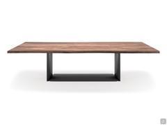 Dragon table by Cattelan with wooden top in Canaletto walnut veneer. The edges are 45° oblique in solid wood