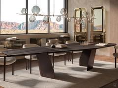 Senator table with imposing 4-metre top. The balanced joints of the top and the wood-metal combination with the base show a majestic and refined design