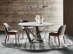 Skorpio round table with Keramik Golden Calacatta matt stone top and graphite painted metal base