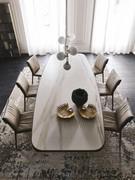 Stratos table by Cattelan with barrel top in Keramik stone and undercounter with rounded edges in brushed bronze matt lacquer