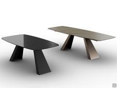 In this photo we can see on the left the fixed Slide table with a dekor barbed smoked glass top, on the right, an extendible table in calacatta gold veined glass 