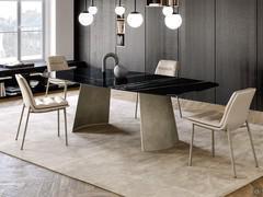 Edwin in version with shaped top in Sahara Noir polished ceramic stone supported by platinum brushed metal base 