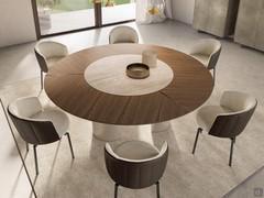 Precious combination of Canaletto walnut of the outer top and central insert in travertine ceramic stone in the Ø220 cm size