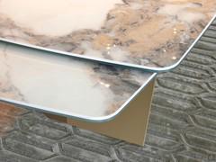 The side extension slides sideways, until it is positioned below the top
