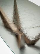 Detail of the extra-clear baked glass top, with its special hammered finish 
