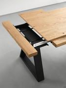 Detail of the Fast extension system (the picture refers to another table) with two extensions of 48 cm each, matching the top. Unlike the bayonet system, the extensions are placed in the thickness of the top