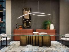 Papel table in the 3.5 version, with impressive 350 cm rectangular bevelled glass top. Base in Oxybrass finish
