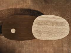 Top view of the Lotus Large table, with contrasting colours and materials. In this case the choice fell on Cocoa-stained ash and Travertino marble, with a cylindrical leg to match the marble top (optional)