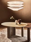 Detail of the travertine marble top and the large curved base in stained ash