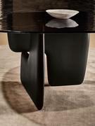 Detail of the legs with their characteristic organic and sculptural shape offered in wood, marble, textured resin or brushed metal