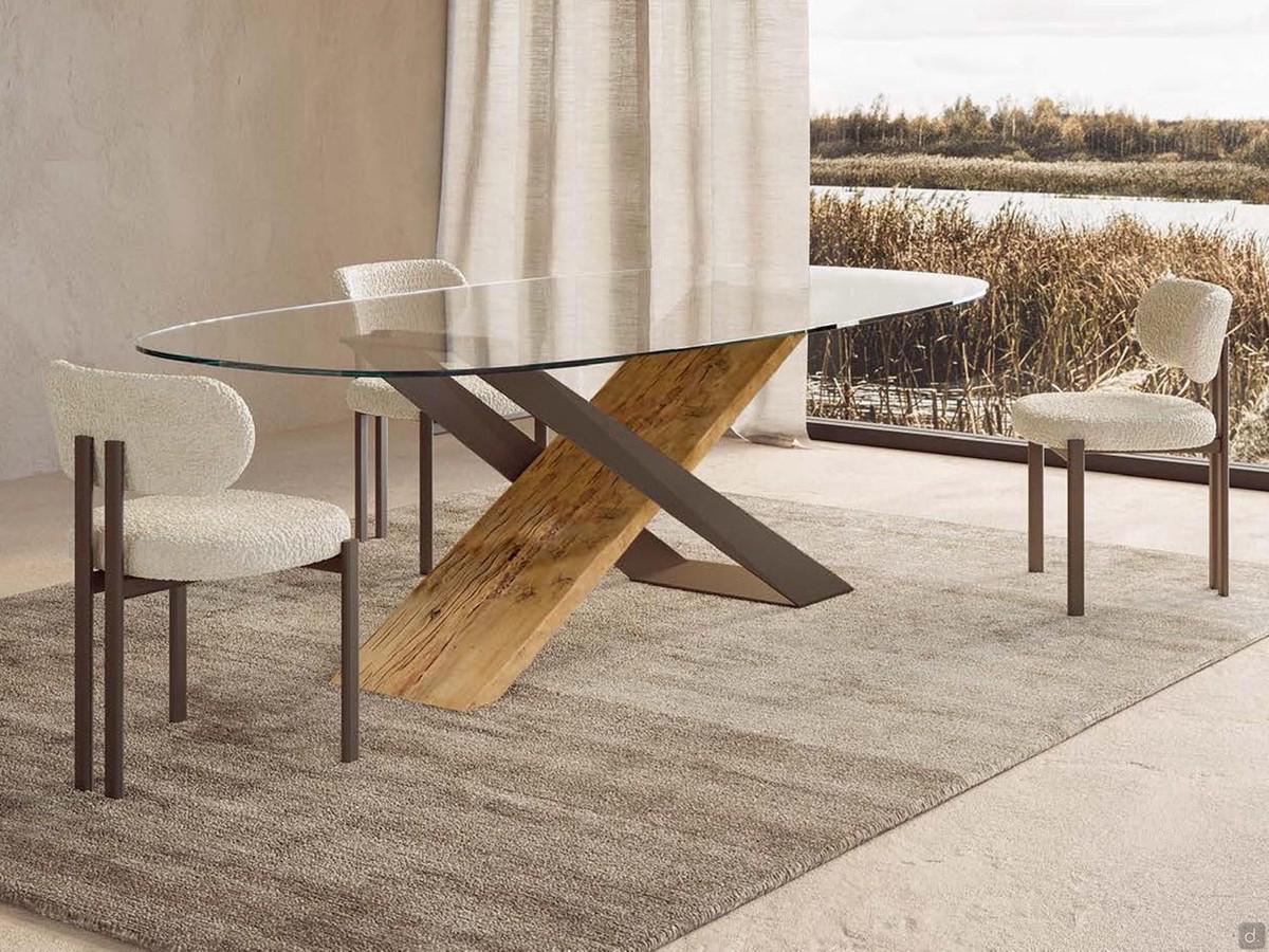 Haynes oval table with 'X' legs in burnished metal and natural secular wood, with extra-clear glass top