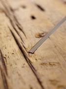 Detail of the joint between the debarked top and metal plinth