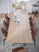 Double table in porcelain stoneware in travertine finish. Shown here in the 200 cm model extendable to 300 cm