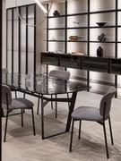 Vigo table in the smoked cast glass version, with special surface ripples due to the heat treatment undergone by the sheet