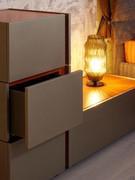 Cleveland bedside table with drawers, here composed by superimposing several single-drawer elements in an irregular, asymmetrical shape