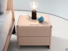 Neon gloss lacquered bedside cabinet in Nude finish, with metal handle on the first drawer and push-pull on the second