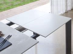 Detail of the extension leaf matching the supporting panel of the ceramic top