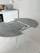 Round table Station with folding extensions hidden in the undertop