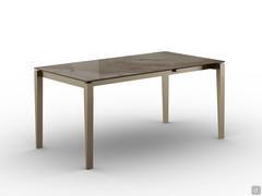 Elegant Diogo table with 140 cm fixed top in glossy onyx amber glass ceramic combined with champagne painted metal base