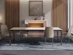 Table in matt calacatta gold veined glass ceramic, coordinated with bronze painted metal base
