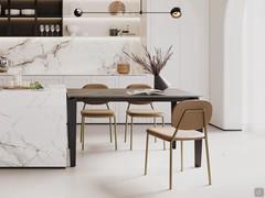 Freddie table with Noir desir matt ceramic stone top and black painted metal frame. Combined with a kitchen island, also in ceramic but with strongly contrasting colours