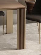 Wooden insert worked with a ribbed effect, inserted on the outer side of the leg. Choice of wood finish canaletto walnut or temocotto dark oak