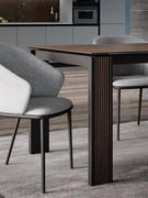 Elegant vertical insert on the leg with a quilted effect in heat-burnt oak. Opaque brown oxide glass ceramic top and black painted metal frame