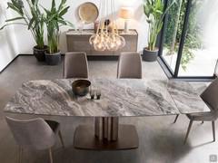 Bahia extending table with both extensions. Each one measures 40 cm and is stored under the table top, which can be easily pulled out thanks to an intuitive rail system