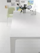 Detail of the matte white painted structure and of the table in white Cleaf laminate
