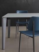 Glass and metal create a decidedly modern yet delicate material mix, linear and muted in tone