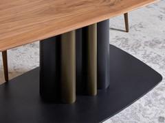 Detail of the central steel tube base in two colours black and brass