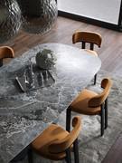 Fixed table with porcelain stoneware top, taken from above and inserted in a modern living context