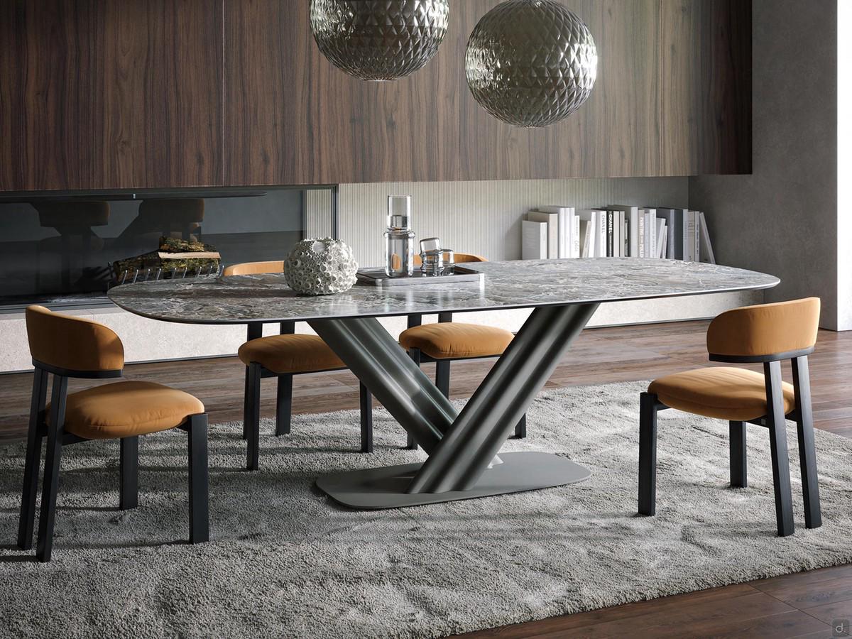 Dionis table in the 250 x 120 cm fixed version, from the base of which grooved legs support the Aubisque stoneware top