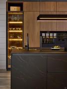 Combination of HPL Ambassador 466 in matte black with golden veins and Cognac Oak veneer wood