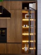 Showcase columns with Europa Grey doors and integrated LED lighting on each shelf