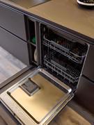 AEG dishwasher with hidden side compartment for detergents