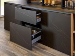 Capacious kitchen island with larder units, drawers and baskets