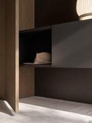 The hanging element in the lower part consists of the drawer and the open compartment, hidden by the hinged door