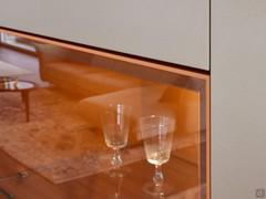 Showcase door made of grey transparent glass