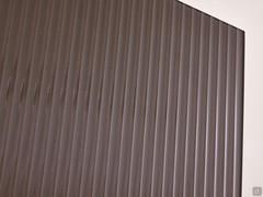 Detail of the back-lacquered bronze glass panel groove