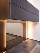 View of the lower portion of the central mirror and of the side strips of etched glass, note the special effect of the backlighting