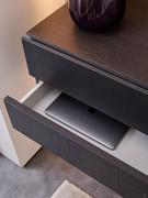 View of the drawer interiors and opening by means of a metal claw