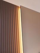 Detail of the LED backlighting: the mirror is made to protrude one centimetre from the side strips, so as to have the minimum space to place the strips