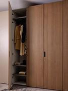 The Driver Wide folding wardrobe, available in several widths, can have two hinged modules at either end, matching the central module