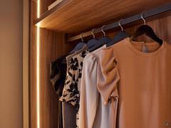 Shelf and hanging tube supplied as standard with hinged wardrobes from the Wide collection, with the addition of the full-height vertical LED bar