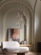 Suspended lamp composition Riflesso in the small version with a satin gold ferrule