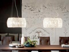 Pair of modern chandeliers with Kidal crystals by Cattelan to illuminate the large wooden top of an Eliot table from the same collection