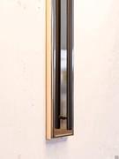 Detail of the Band lamp holder in the gold and black wall version