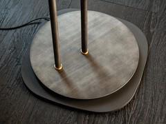 Detail of the floor lamp, made of iron grey painted steel structure, lower plate in painted steel 