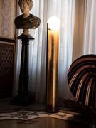 Minimal Dew floor lamp with black Marquina marble base, matt black painted metal frame outside, gold leaf metal inside